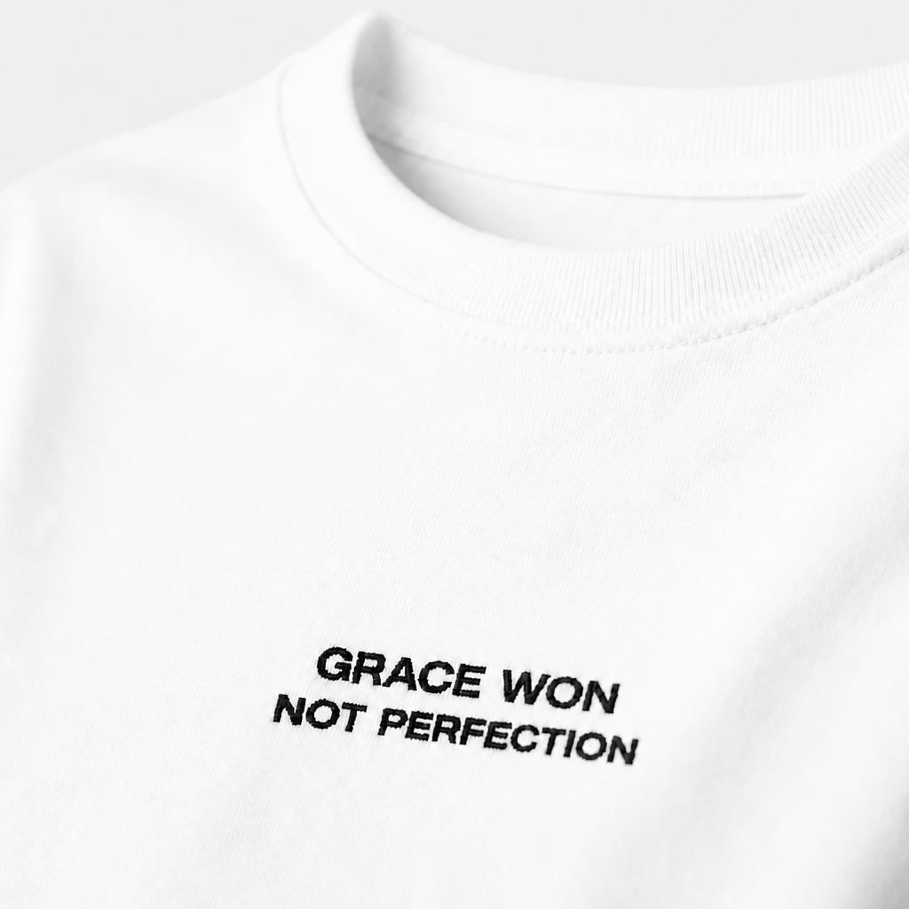Close-up of embroidered on Grace Won t-shirt