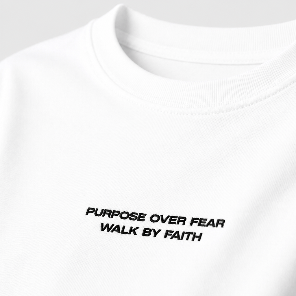 Close-up of embroidered on Purpose over Fear  t-shirt