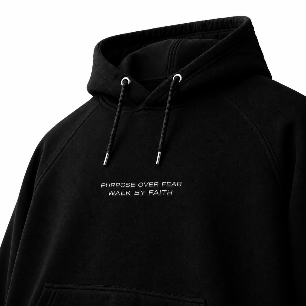 Close-up of embroidered on Purpose over fear hoodie